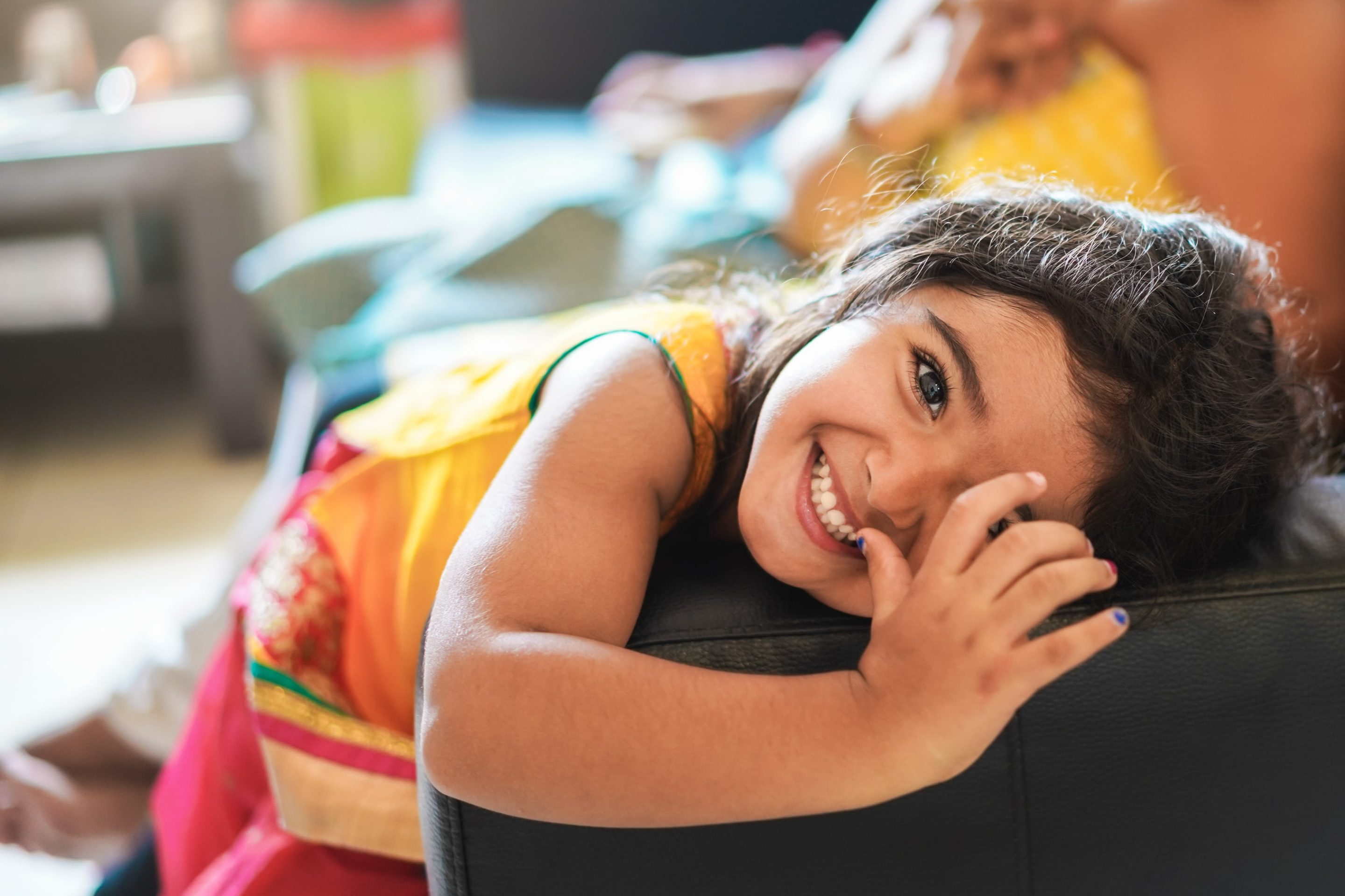 VEVS Global - Dependent Applicants From A Previous Relationship image Child smiling after finding out that The Partner Visa allows for the inclusion of any dependent children from a previous relationship.