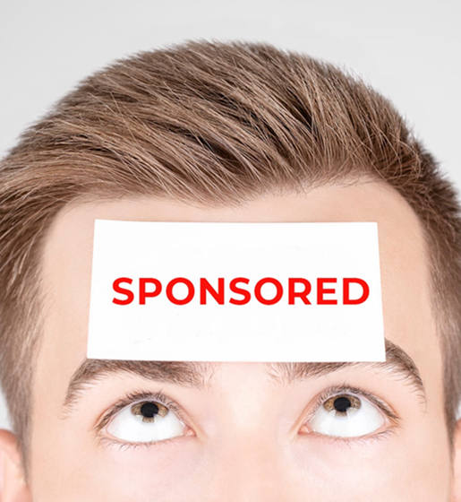 VEVS Global - Employee Sponsored Visa Assistance Perth - Man with sponsored sticker on forehead. A man looking at a card on his head that states that he can Work and stay in Australia with an Employee Sponsor