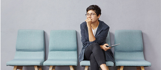 young-brunette-woman-sitting-waiting-room