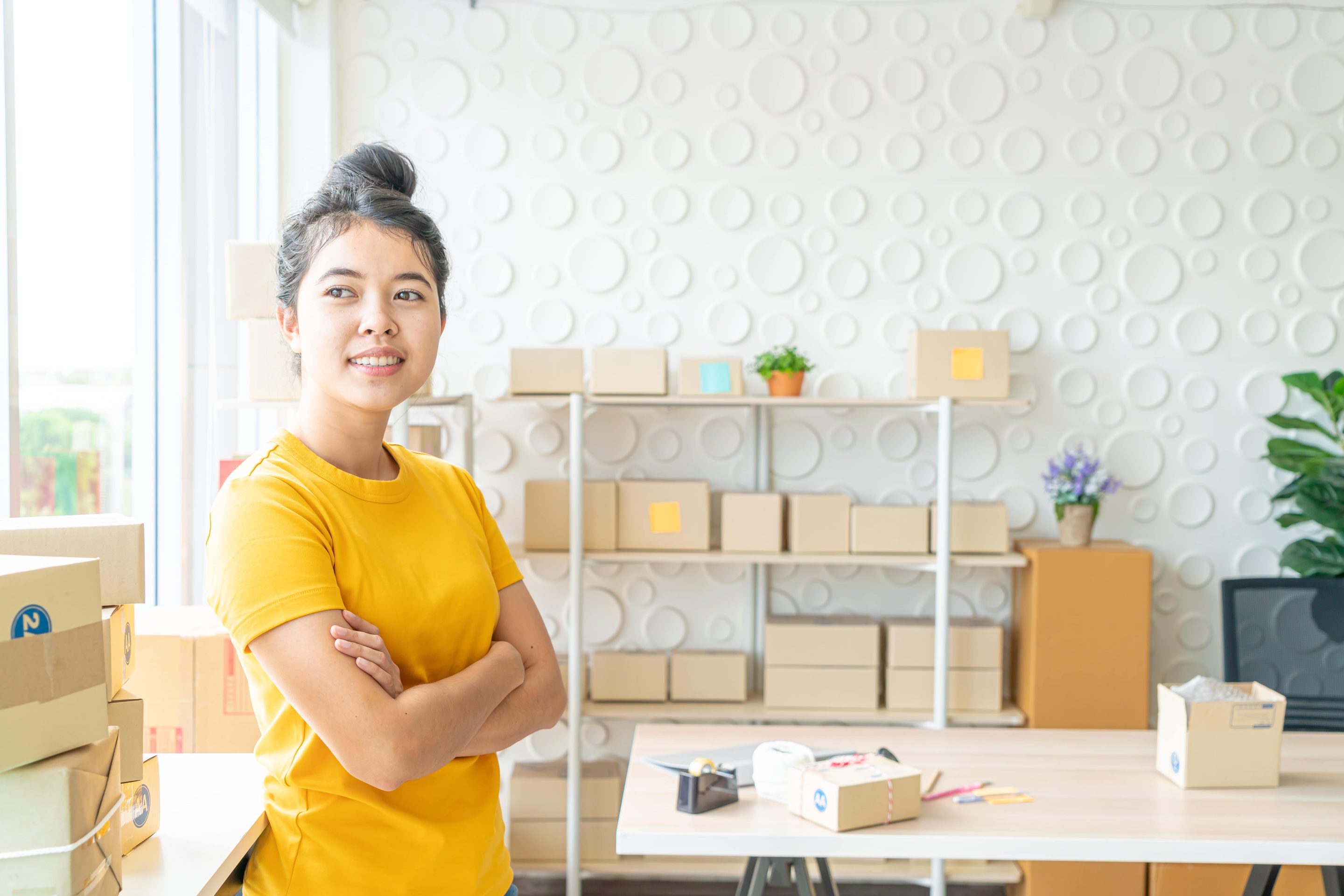 asian-women-business-owner-working-home-with-packing-box-workplace.pg