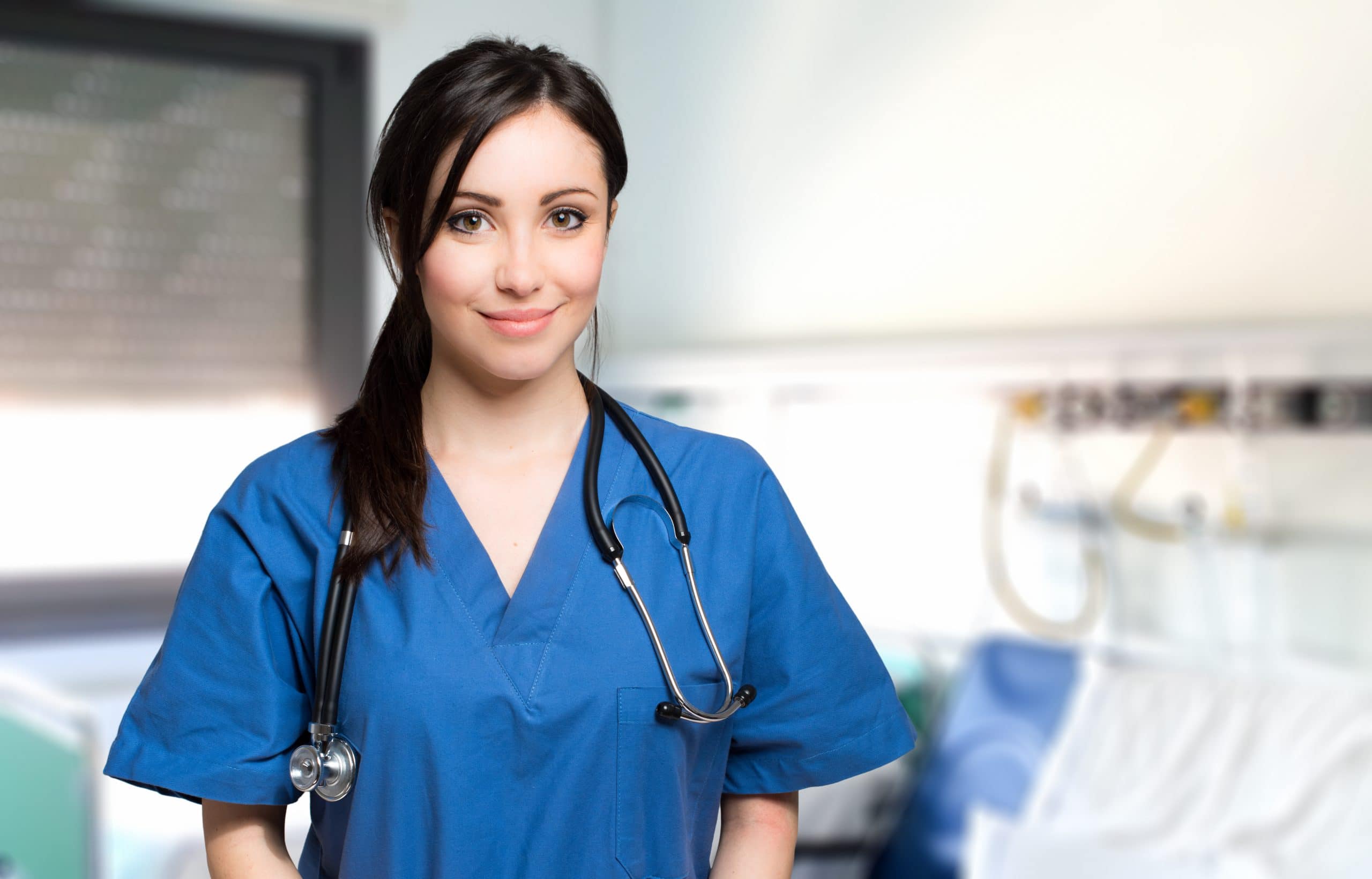 An international student studying nursing smiling at the camera