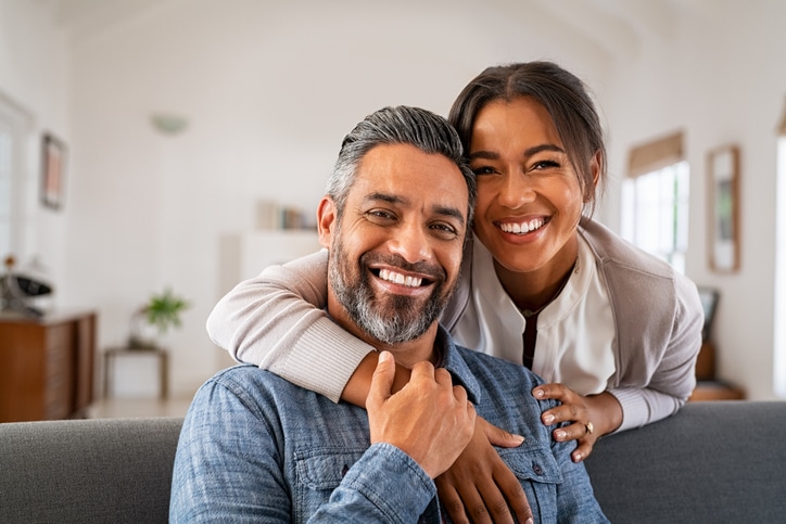 VEVS Global - Partner Visa Services - Couple Smiling For Camera A couple smiling for the camera after being granted a partner visa in Australia thanks to the migration services of VEVS Global